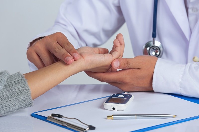 World diabetes day;docter checking patient pulse’s World diabetes day;docter checking patient pulse's